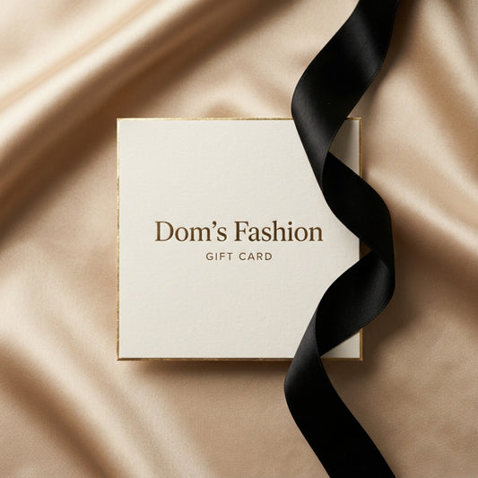 Domβs Fashion gift card on champagne satin with a black ribbon